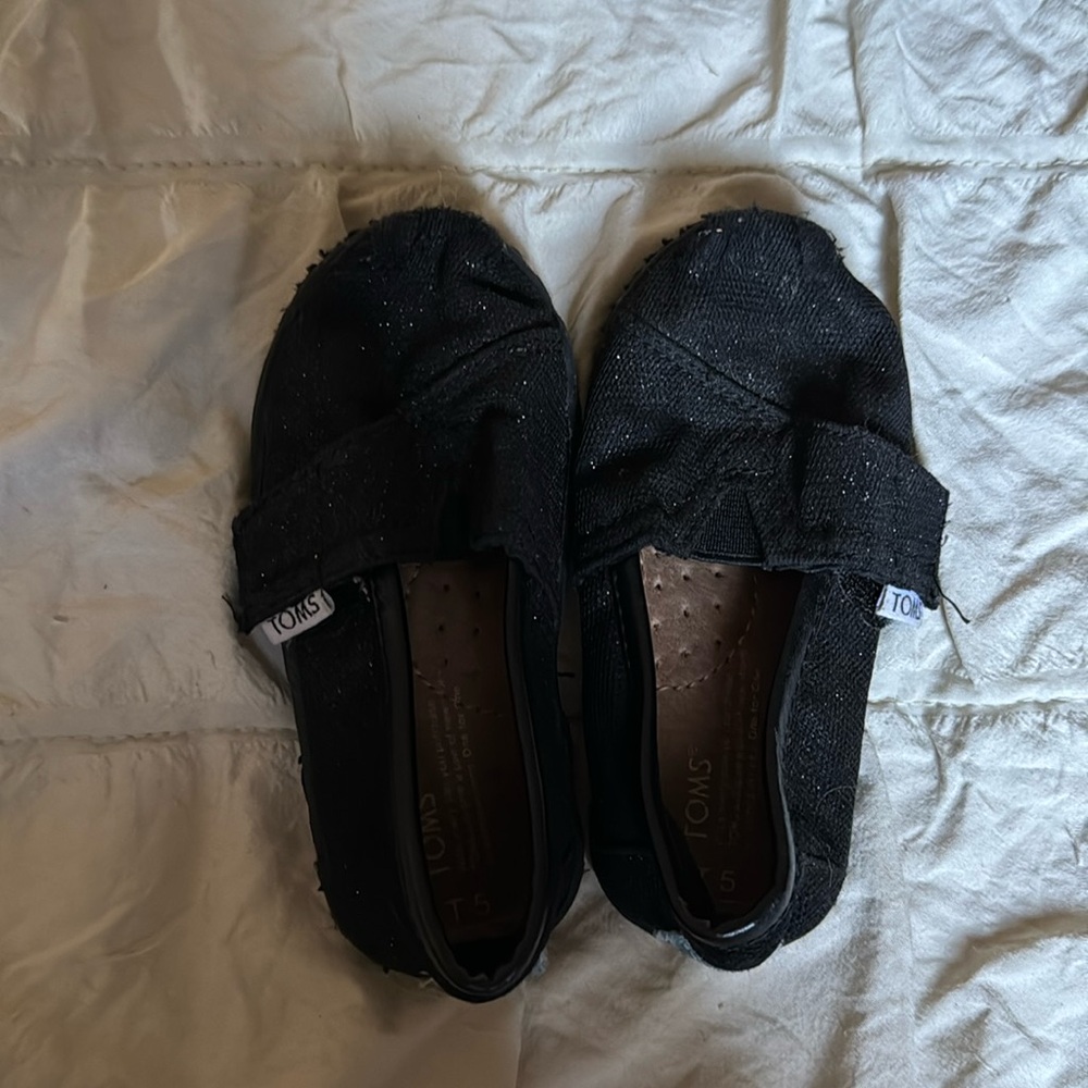 Tom’s black glitter shoes